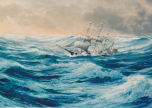 A four masted barque shortening sail off Cape Horn.